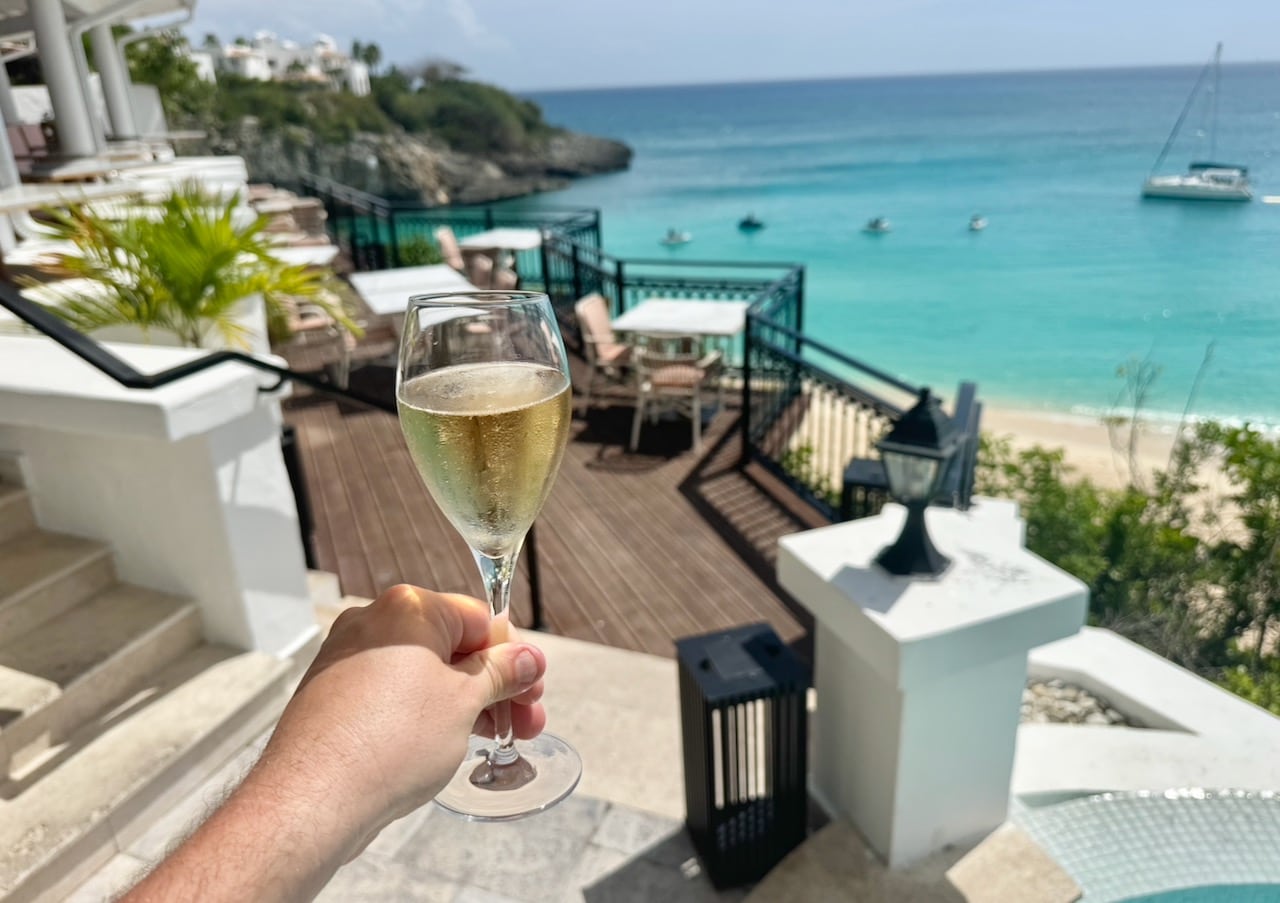 At check-in sip a glass of prosecco while soaking in the Caribbean sun.