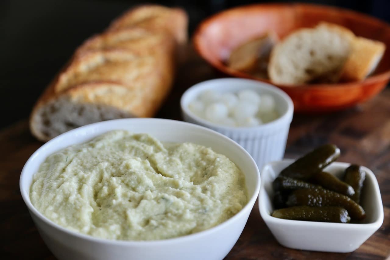 Fromage Fort will be a light green colour thanks to the blending of cheese with fresh herbs.