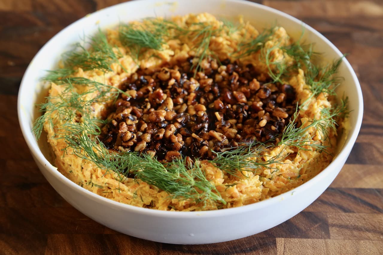 Garnish the dip with paprika walnuts and sprigs of dill.